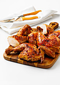 Sous vide piri piri-style flattened chicken with serving utensils