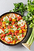 Low-carb celeriac pizza with cherry tomatoes and mozzarella