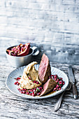 Lamb fillet with chickpea purée and a pomegranate topping