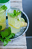 Lemon and lime switchel with ginger and mint