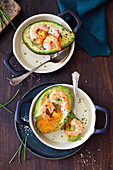 Oven-baked avocado with egg and prawns