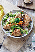 A vegetable salad with sesame seed chicken