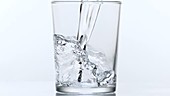 Water in glass, slow motion