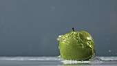 Apple in water, slow motion
