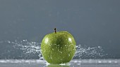 Apples in water, slow motion