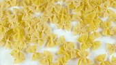 Dry pasta falling, slow motion