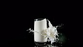 Glass of milk exploding slow motion