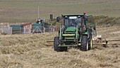 Farmer gathering in hay