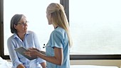 Doctor talking to female patient