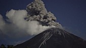 Reventador volcano erupting at night, time-lapse footage