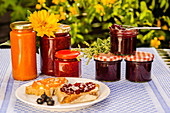 Jars of homemade jam and bread and jam