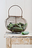Gherkins (for pickling) in a wire basket