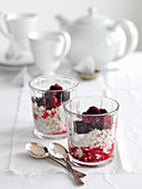 Oatmeal with yoghurt and berries in glasses