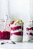 Creamy vegan overnight oats with berry chia jam and bee pollen