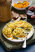 Spaghetti with pumpkin carbonara and roasted hazelnuts