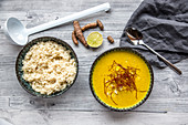 Turmeric soup with rice and chili strings