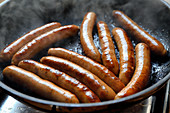 Merguez sausages in a pan
