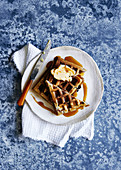 Glutin free blueberry waffles, drizzled with maple syrup and maple butter