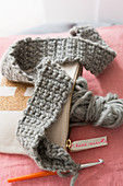 Crocheted grey wool in a bag