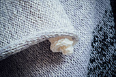 A hand-knitted cape (detail of rolled edge)