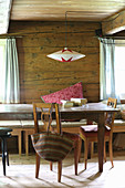 Hand-made paper lampshade over rustic dining table