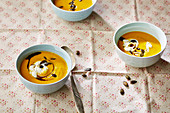 Pumpkin and carrot soup with pumpkin seeds