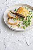 Chicken wellingtons with creamy pea sauce