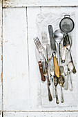 Vintage cutlery on a white surface