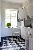 Rustic utility room with chequered floor