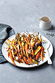 Roasted baby carrots and parsnips with honey and mustard dressing