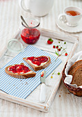 Bread with butter and strawberry jam