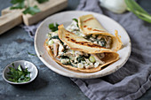 Pancakes with turkey, spinach and spring onions