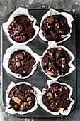 Chocolate muffins in a muffin tin