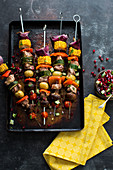 Pork and vegetable kebabs with pomegranate salsa