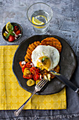 Butternut waffles with a fried egg and tomato salsa