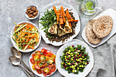 Various vegetable salads with pita bread
