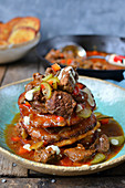 Potato pancakes with beef in a homemade sauce