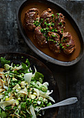 Braised pork chops and fennel salad with apple salsa, rocket and parmesan