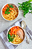 Broth with noodles and turkey