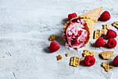 Raspberry ice cream in a cone