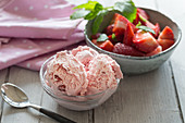 Strawberry ice cream in a glass bowl