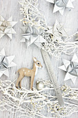Wreath handmade from white twigs, origami stars and deer figurine