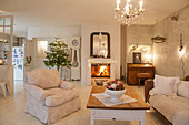Lamps, lights and Christmas tree in shabby-chic living room