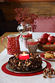 Handmade Advent wreath decorated with nuts, spices and pine cones
