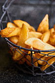 Fried potatoes served in a metal basket
