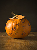 Pumpkin decorated with handbag brand logos