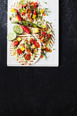Coconut fish tacos with mango salsa and blistered chillies