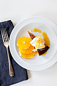 Orange Polenta Cake served with an orange, honey syrup and whipped cream