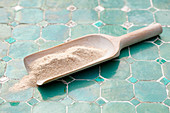 Tsampa flour on a wooden scoop