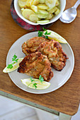 Wiener Schnitzel with potato and cucumber salad